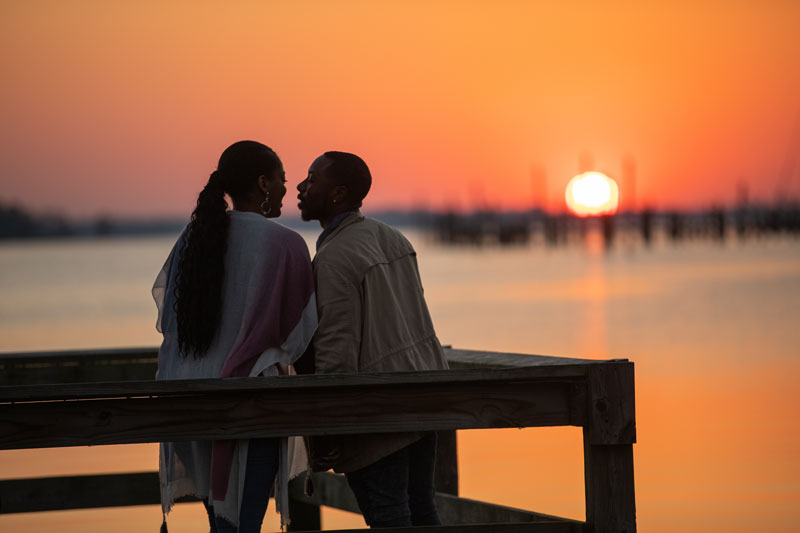 couple enjoying sunset at waterfront in Elizabeth City, NC
